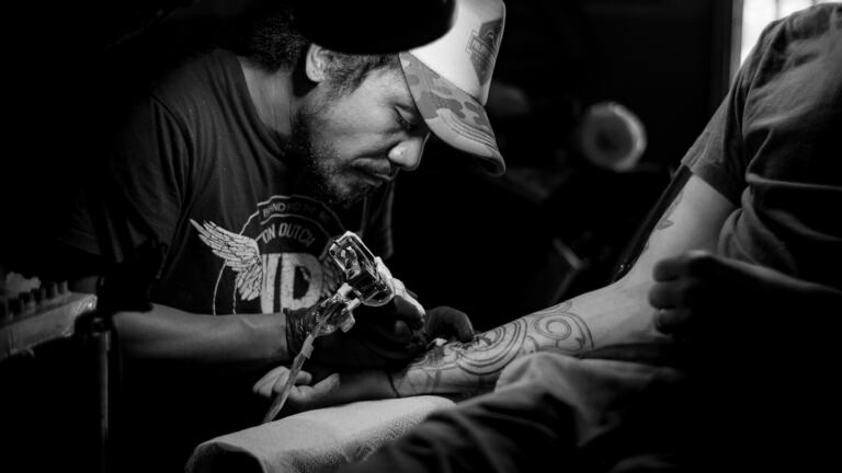 Tattoo Artist at Work could CPR soon be needed?
